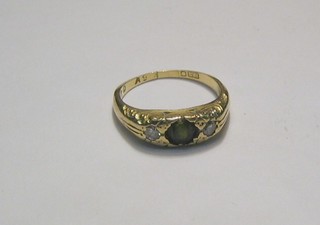 A lady's gold dress ring set a "sapphire" and 2 diamonds (cut)