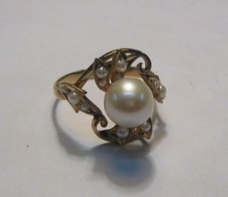 A lady's gold dress ring set pearls