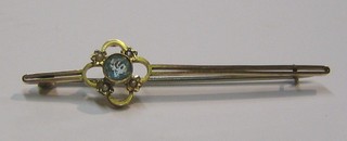 A lady's 9ct gold bar brooch set an aquamarine and 4 demi-pearls