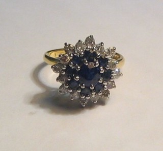 A lady's attractive 18ct gold diamond and sapphire cluster ring