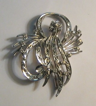 A lady's 18ct white gold floral spray brooch set numerous diamonds