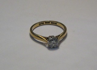 A lady's 18ct gold engagement/dress ring set a solitaire diamond