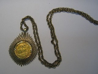 An Edwardian VII gold half sovereign 1906 contained in a pendant mount hung on a gold chain