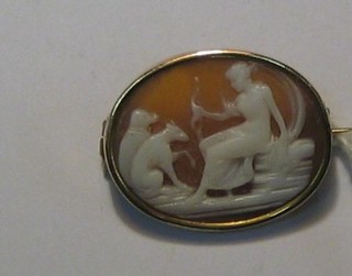 an oval shell carved cameo brooch decorated Diana and 2 wolves