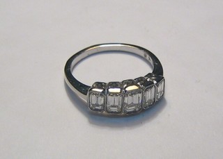 A lady's 18ct white gold dress ring set 5 emerald cut diamonds (1.46ct)