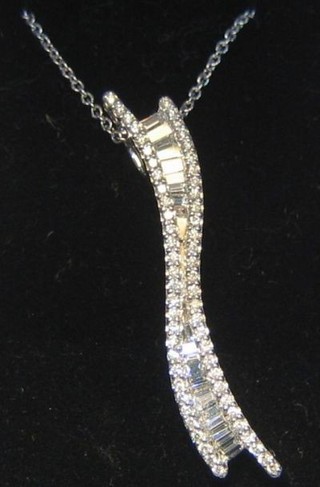 A lady's 18ct white gold pendant set numerous baguette cut diamonds (approx 0.55ct)