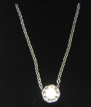 A lady's solitaire pendant set an octagonal cut diamonds (approx 0.36ct)