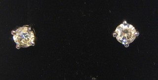 A pair of lady's diamond ear studs (approx 0.5ct)