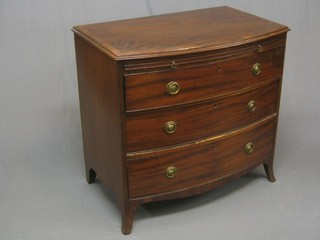 A handsome Georgian mahogany bow front chest of drawers, the cross banded top with ebony and satinwood stringing, the base fitted a brushing slide above 3 long drawers with oval brass escutcheons and replacement brass drop handles, raised on bracket feet 37"