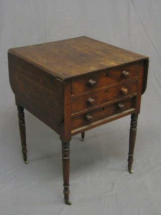 A 19th Century mahogany drop flap work table, fitted 3 long drawers, raised on ring turned supports ending in brass caps and castors (missing 2" section from left hand flap and damage to right hand top, escutcheons missing) 19"