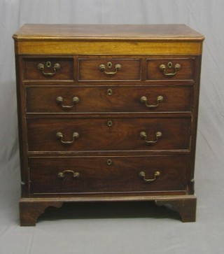 A handsome Georgian mahogany chest of 3 short and 3 long drawers with fluted canted corners and original brass swan neck drop handles, raised on bracket feet (some cock bead missing) 39"