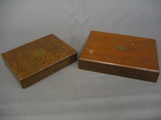 A set of 6 fish knives and forks contained in an oak canteen  and a part canteen of fish knives and forks in an oak canteen box
