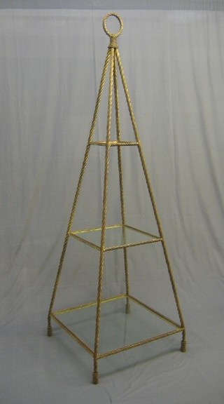 A handsome gilt metal finished pyramid shaped 3 tier what-not 79" 