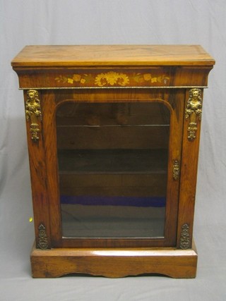 A Victorian inlaid walnut Pier cabinet with gilt metal mounts to the sides, the interior fitted a shelf enclosed by an arched panelled door, raised on a platform base 31" (some old scratches to top and missing a section of inlaid top to right hand side) 