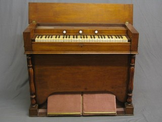 A  Victorian walnut harmonium with 3 stops by Edwards & Sons of Brighton contained in a walnut case converted to electricity