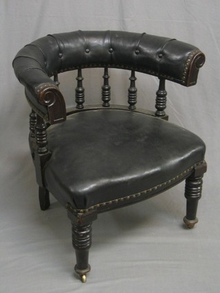 A 19th Century mahogany open arm tub back office chair with bobbin turned decoration, raised on turned feet