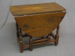 A 17th/18th Century oak oval gateleg dining table raised on turned supports 33"