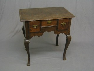 An 18th Century oak low boy fitted 1 short and 2 long drawers with shaped apron, raised on cabriole supports 28"