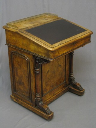 A Victorian bleached and figured walnut Davenport with brass three-quarter gallery fitted an inkwell drawer, the pedestal fitted 4 long drawers enclosed by a panelled cupboard 24"