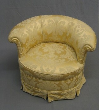 A tub back chair upholstered in yellow material