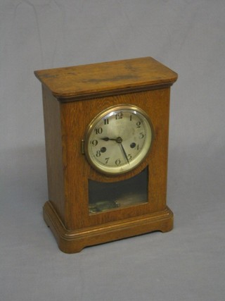 A 19th Century Continental striking 8 day bracket clock with silvered dial and Arabic numerals, contained in an oak case