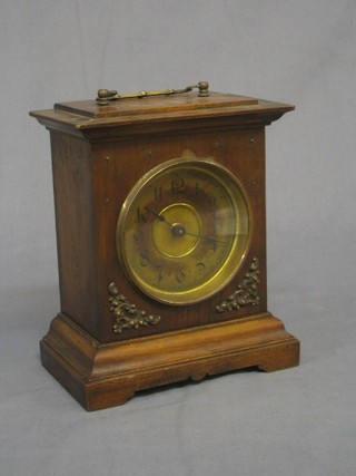 A 19th Century Continental 8 day striking mantel clock contained in a walnut case with gilt metal spandrels (2 missing)