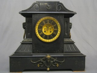 An impressive Victorian French 8 day striking mantel clock with visible escapement and Roman numerals contained in a black architectural case