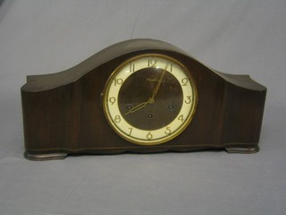A 1950's German  8 day chiming mantel clock contained in an arched case