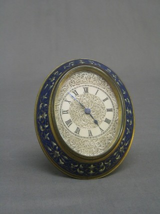 A handsome  19th/20th Century French easel travelling clock with oval engraved silvered dial and Roman numerals contained in a blue champ leve enamelled case 5"