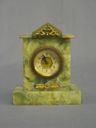 A 19th/20th Century bedroom timepiece contained in an onyx case