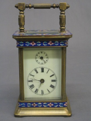 A 20th Century Indian carriage alarm clock with silvered dial contained in a champ leve enamelled case