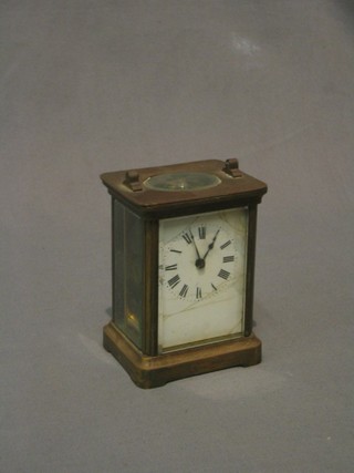 A 19th Century French 8 day carriage clock with rectangular enamelled dial contained in a gilt metal case (dial heavily cracked and handle to top missing)
