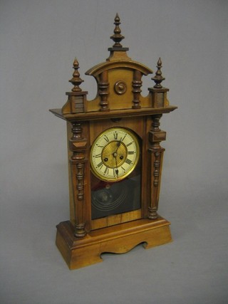 An American 8 day striking shelf clock contained in a walnut case 