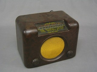 A Bush type DAC 90A radio contained in a brown Bakelite case 