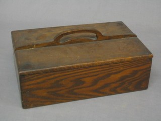 An oak twin compartment cutlery box with hinged lid