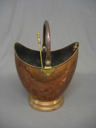 A 19th Century copper helmet shaped coal scuttle, together with a brass coal shovel, poker and fire tongs