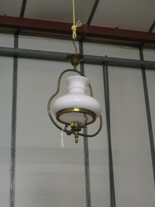 A reproduction 19th Century style hanging light fitting in the form of an oil lamp with Doulton decoration