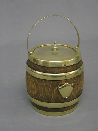 A 1930's circular coopered oak biscuit barrel with silver plated mounts
