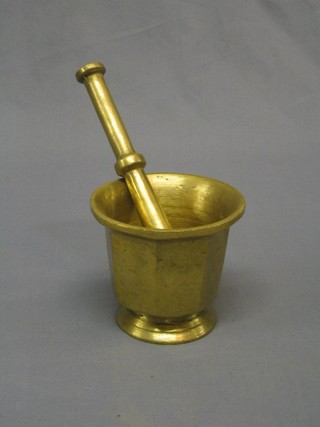 An brass mortar and pestle