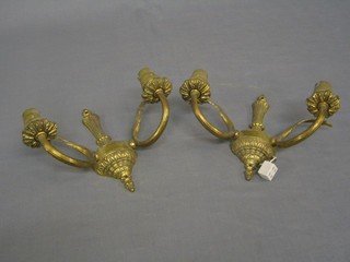 A pair of gilt metal twin light wall brackets
