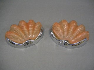 A pair of Art Deco pink glass and chromium plated wall mounting light fittings