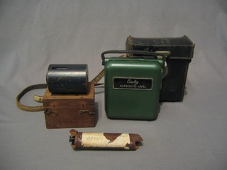 A Cowley surveyor's level, cased, a Lawes level and 1 other item of surveying equipment, boxed