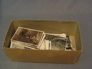 A collection of various black and white postcards mostly England 