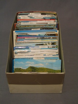 A collection of various coloured postcards