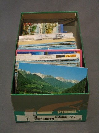 A collection of various coloured postcards