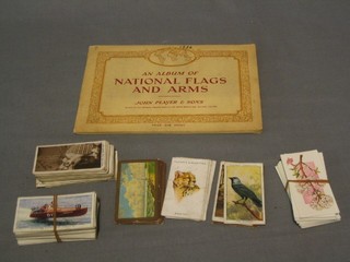 An album of Player's cigarette cards National Flags of the World and a small collection of miscellaneous cigarette cards