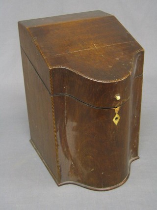 An 18th Century mahogany knife box of serpentine outline with feather banding and stringing and ivory escutcheons, converted to a stationery box (crack to lid and some damage above escutcheon) 8"