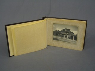 An album containing various photographs of a country house garden Marden Ash