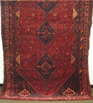 A contemporary red ground Shiraz rug 135" x 86"