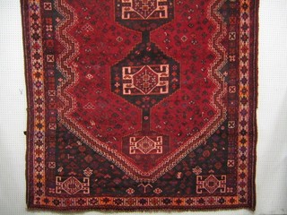 A contemporary red ground Shiraz rug 119" x 82"